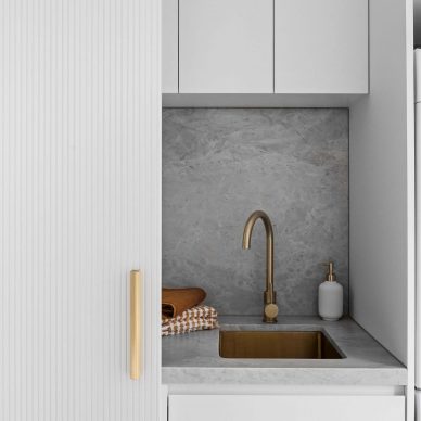 Euro Laundry Renovation South Melbourne Interior Design Minimalist Home Natural Stone Benchtop and Splashback Brushed Brass Fittings